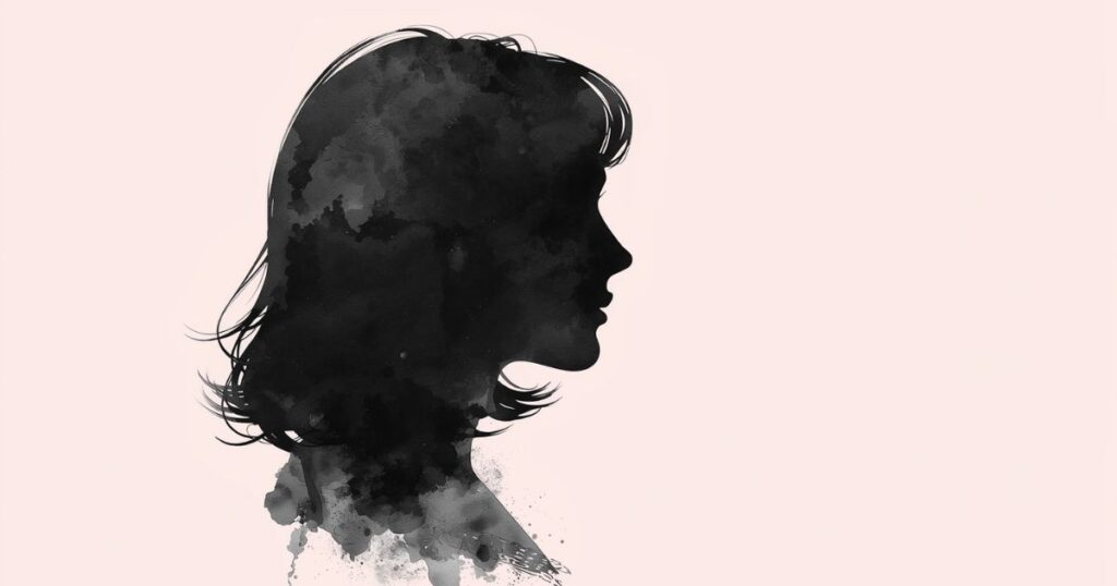 セミロングの女性の横顔で背景はピンク